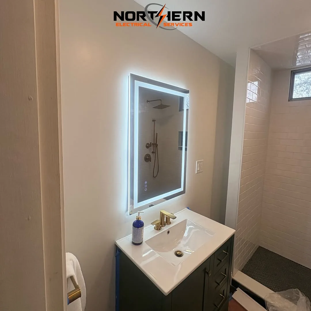 Finished bathroom with LED mirror and vanity