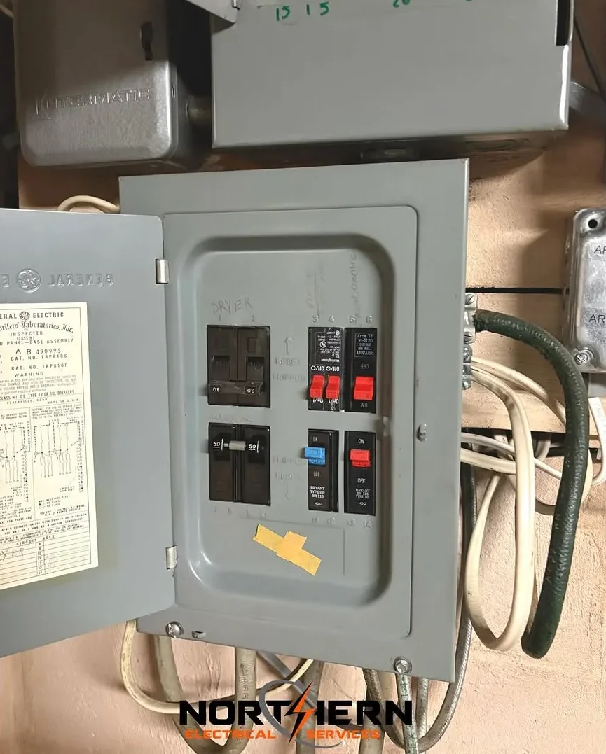 Old GE breaker panel before replacement