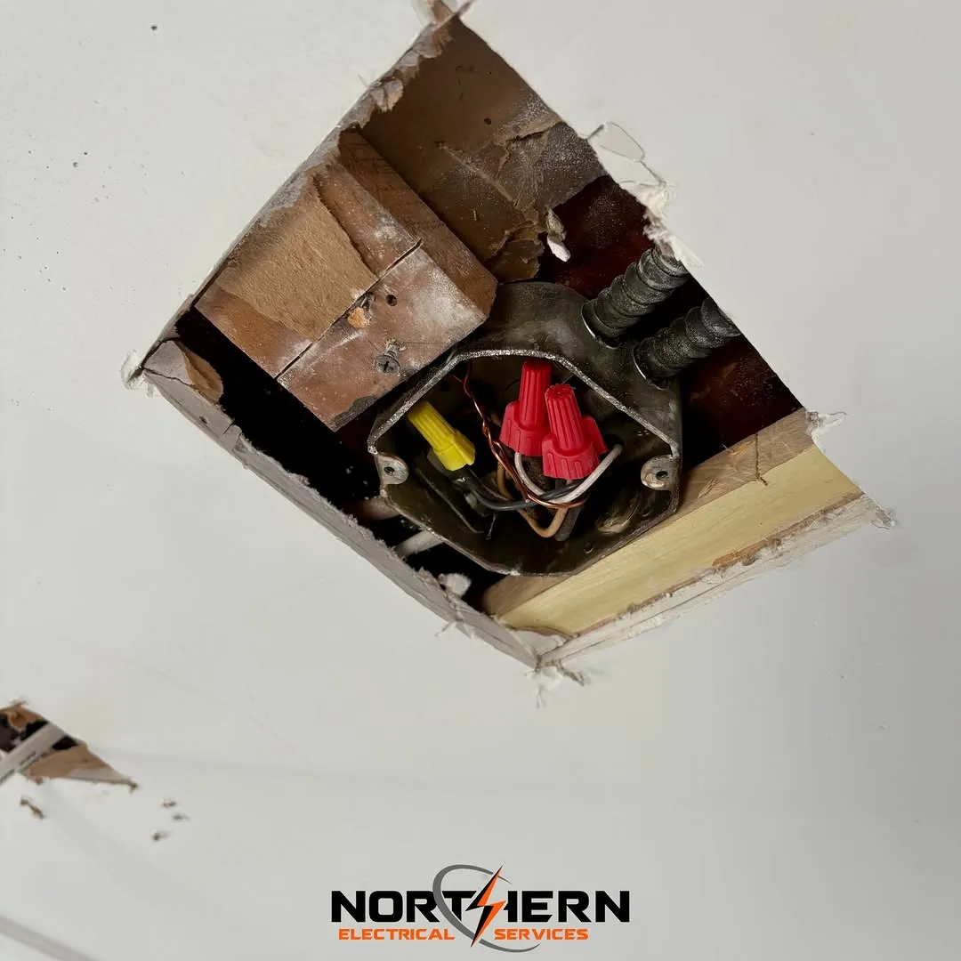 Ceiling junction box opened and rewired