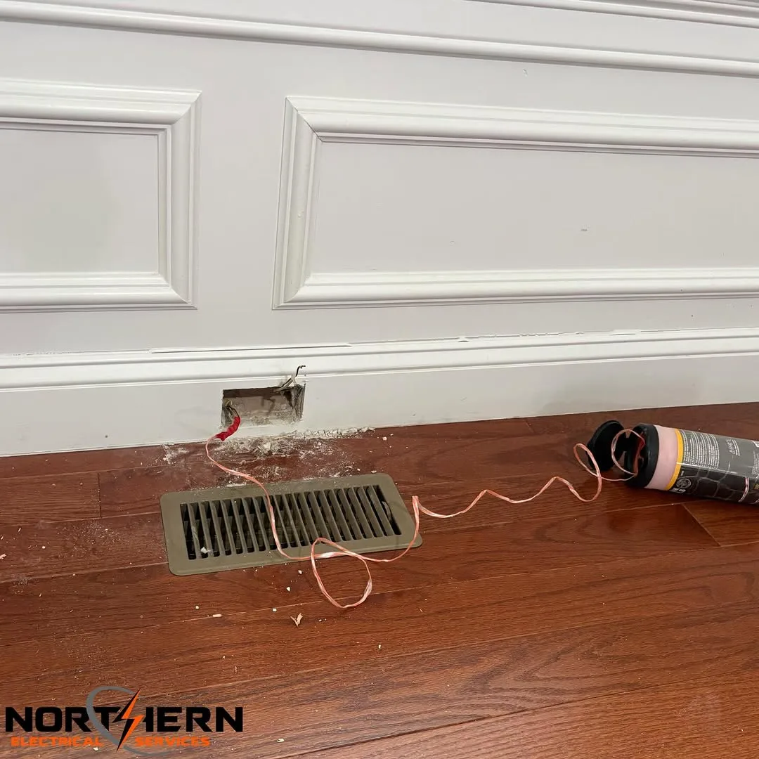 Wire being fished through floor vent