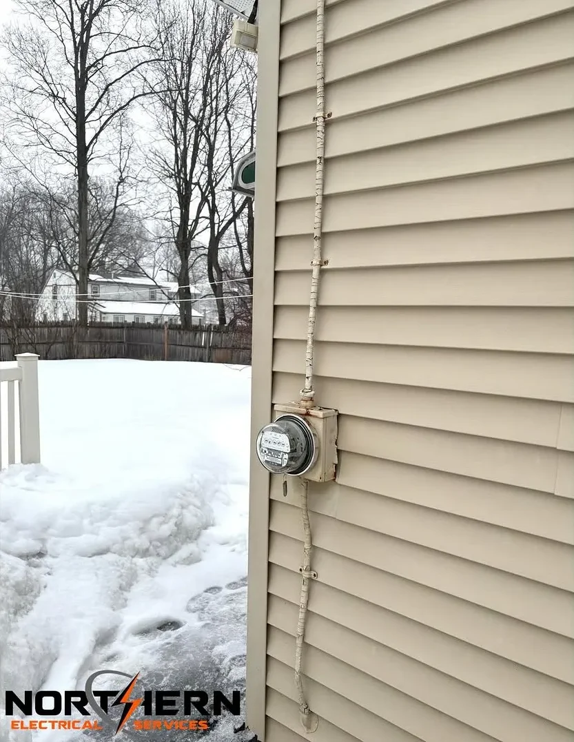 Old meter base with frayed service entrance cable